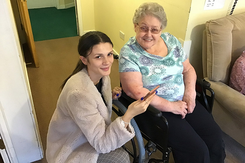 Resident Denise Smith and sixth form student Fiona Morsy getting to grips with technology
