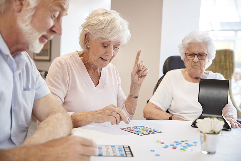 Elderly care residents play bingo