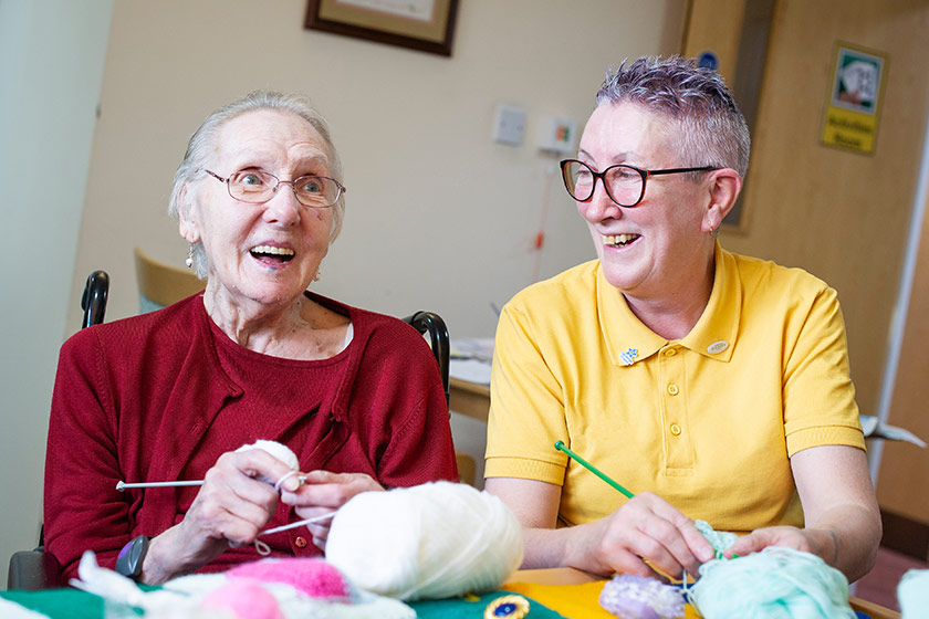 Sanctuary Care staff and resident engage in activities